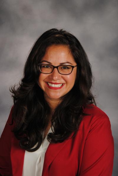 Headshot of Dr. Guevara, her hair is black and she is wearing glasses